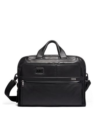 tumi leather carry on luggage