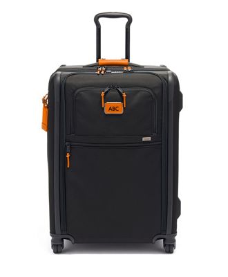 tumi orange luggage